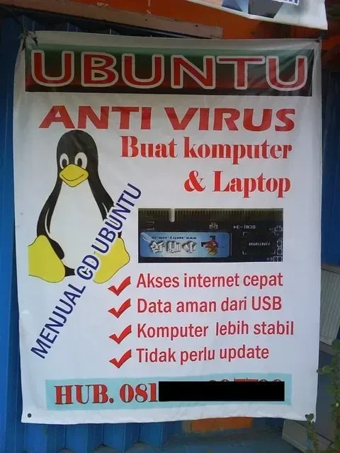 Spanduk kios komputer menyebut Ubuntu & antivirus